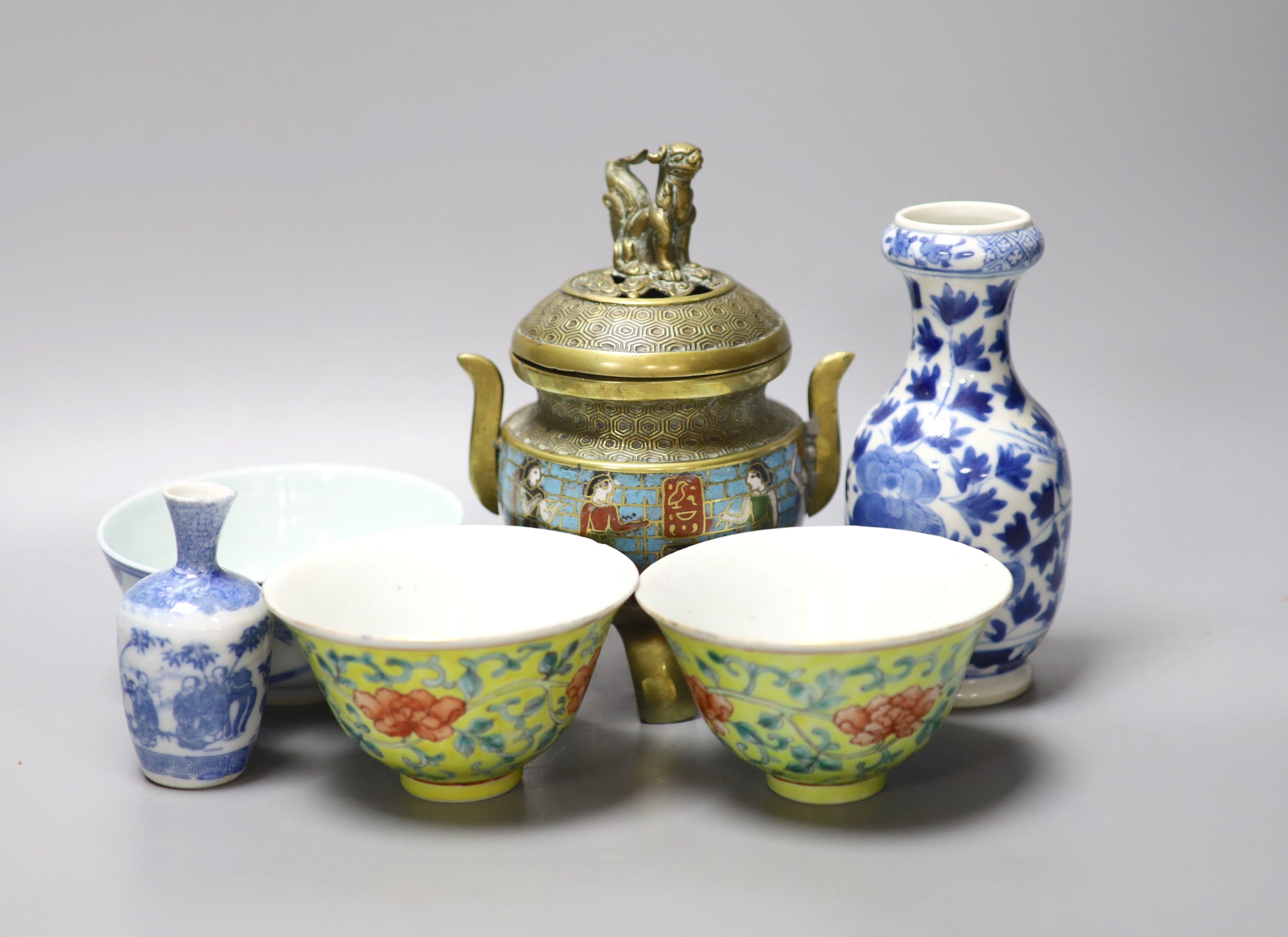 A group of Chinese porcelain, 19th /20th century, to include a pair of yellow ground bowls, 10.8 cm diameter, a blue and white vase, Xuande mark, a similar bowl and vase, and a champleve enamel bronze koro and cover